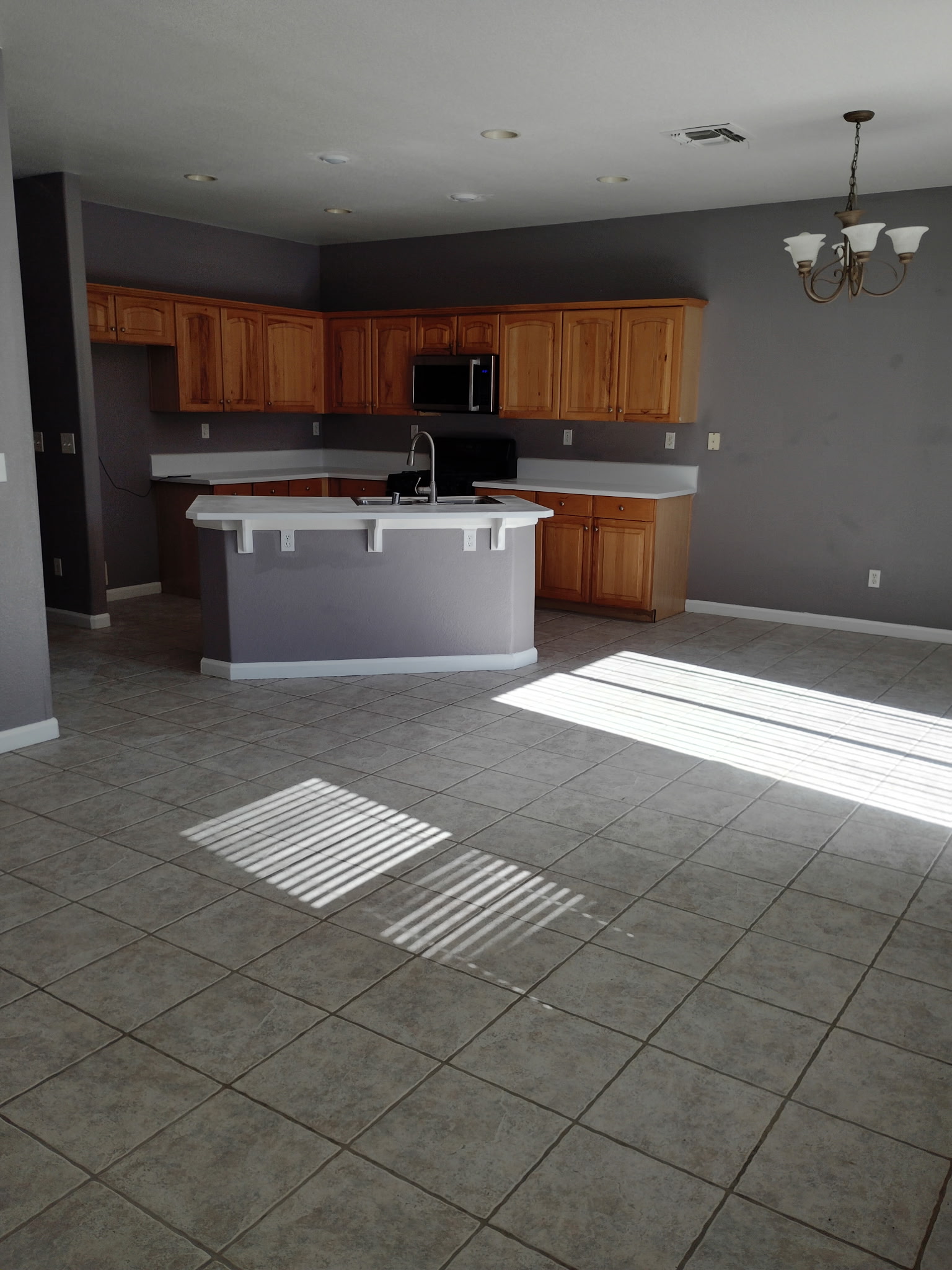 Open kitchen with island and dining area at 4437 Giselle Lane
