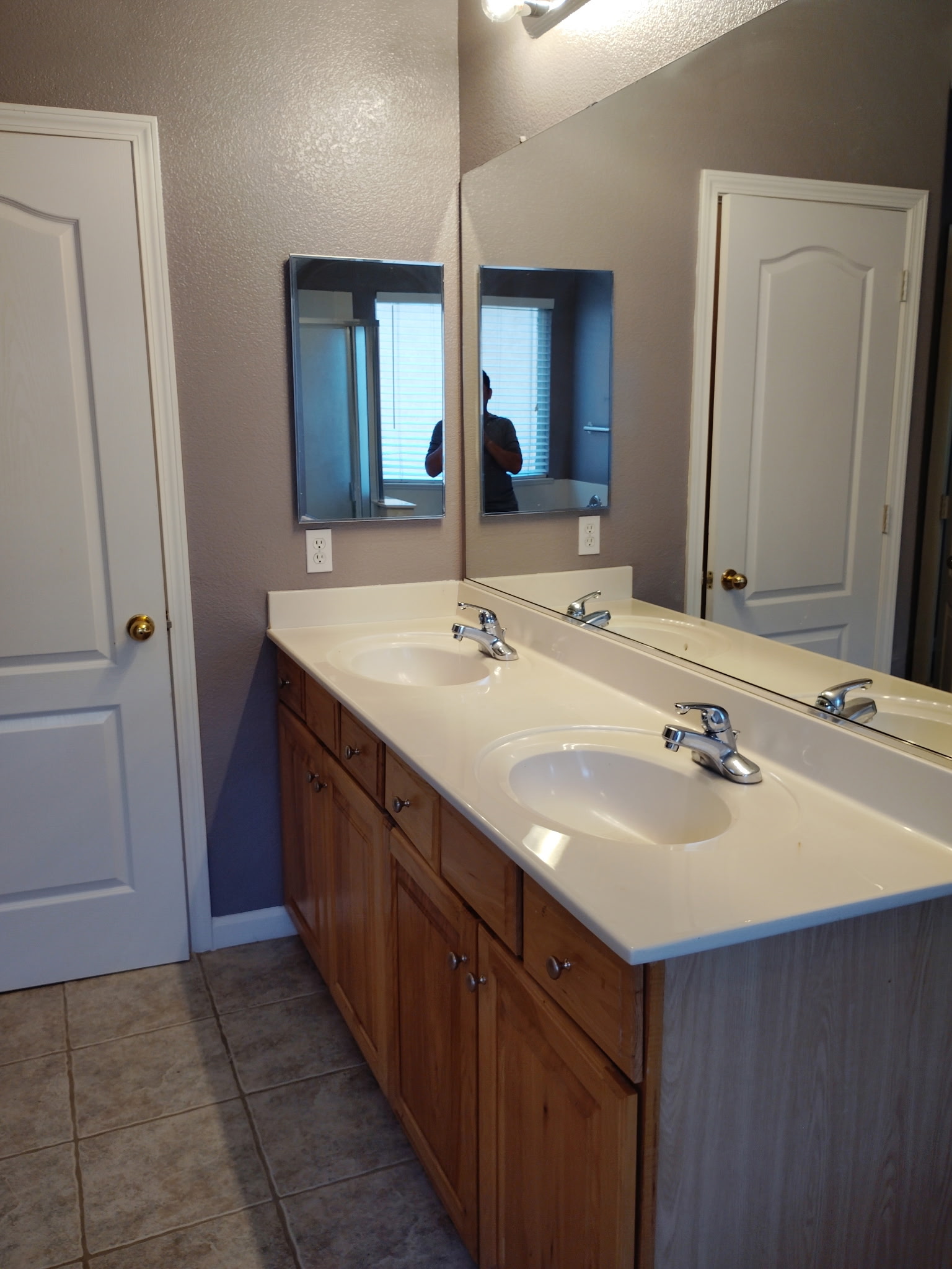 Primary bathroom with dual-sink vanity at 4437 Giselle Lane