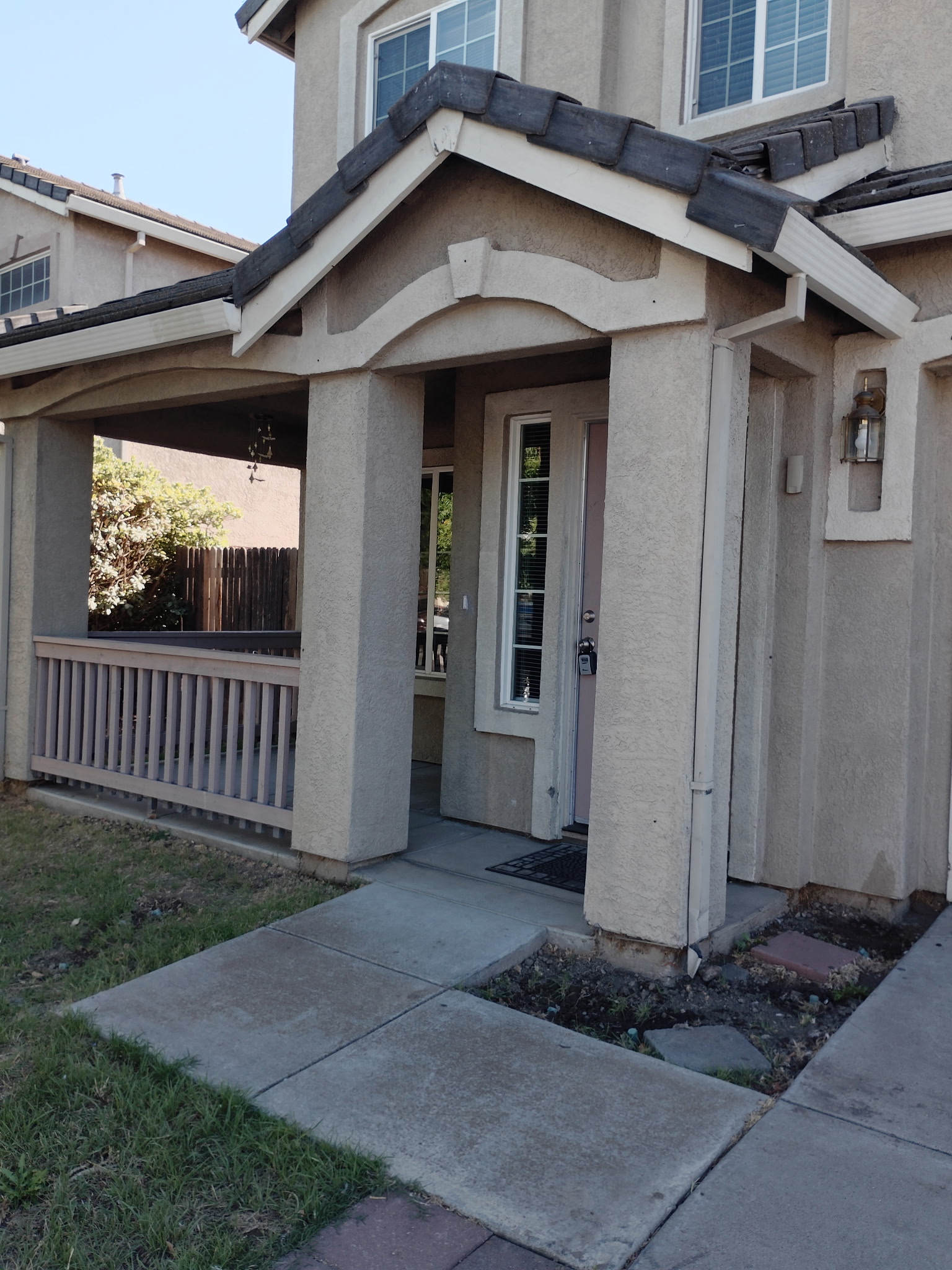 Covered front porch and entry door at 4437 Giselle Lane