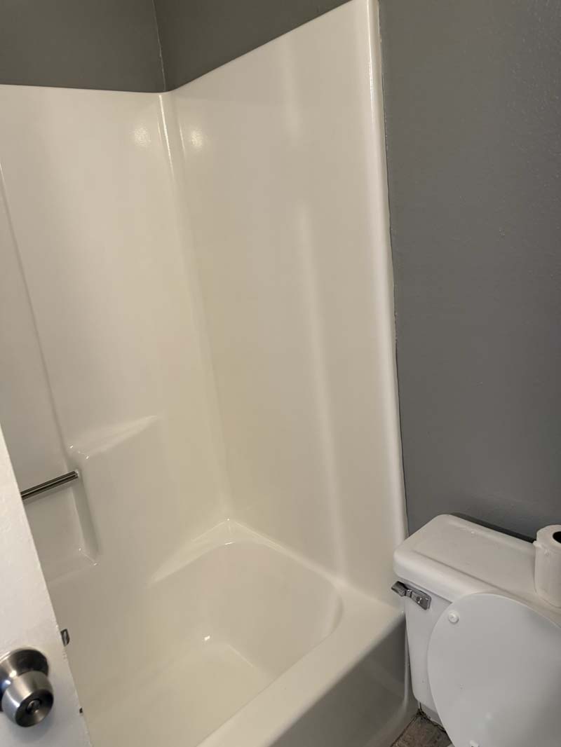 Full bathroom with shower and tub surround at 674 Gannet Ct
